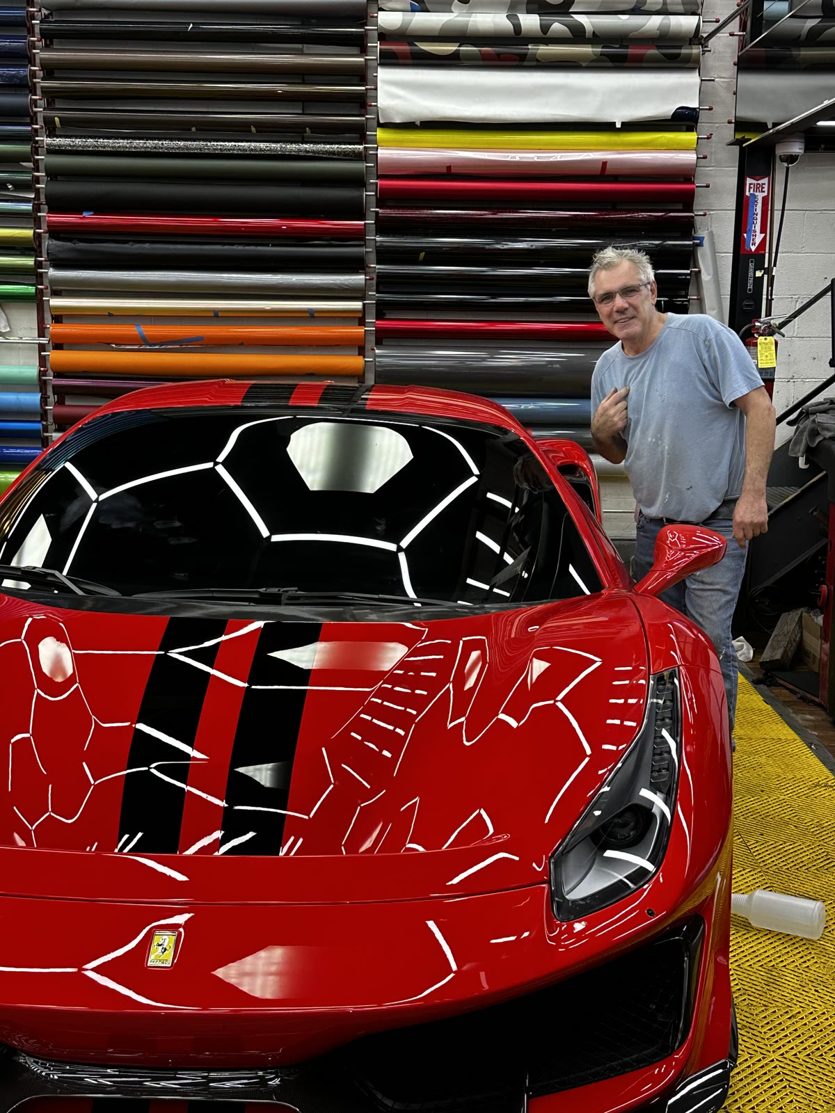 Danny with a red Ferrari at Auto Undented